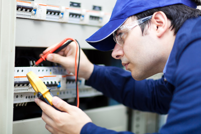 An expert working on a commercial electrical system