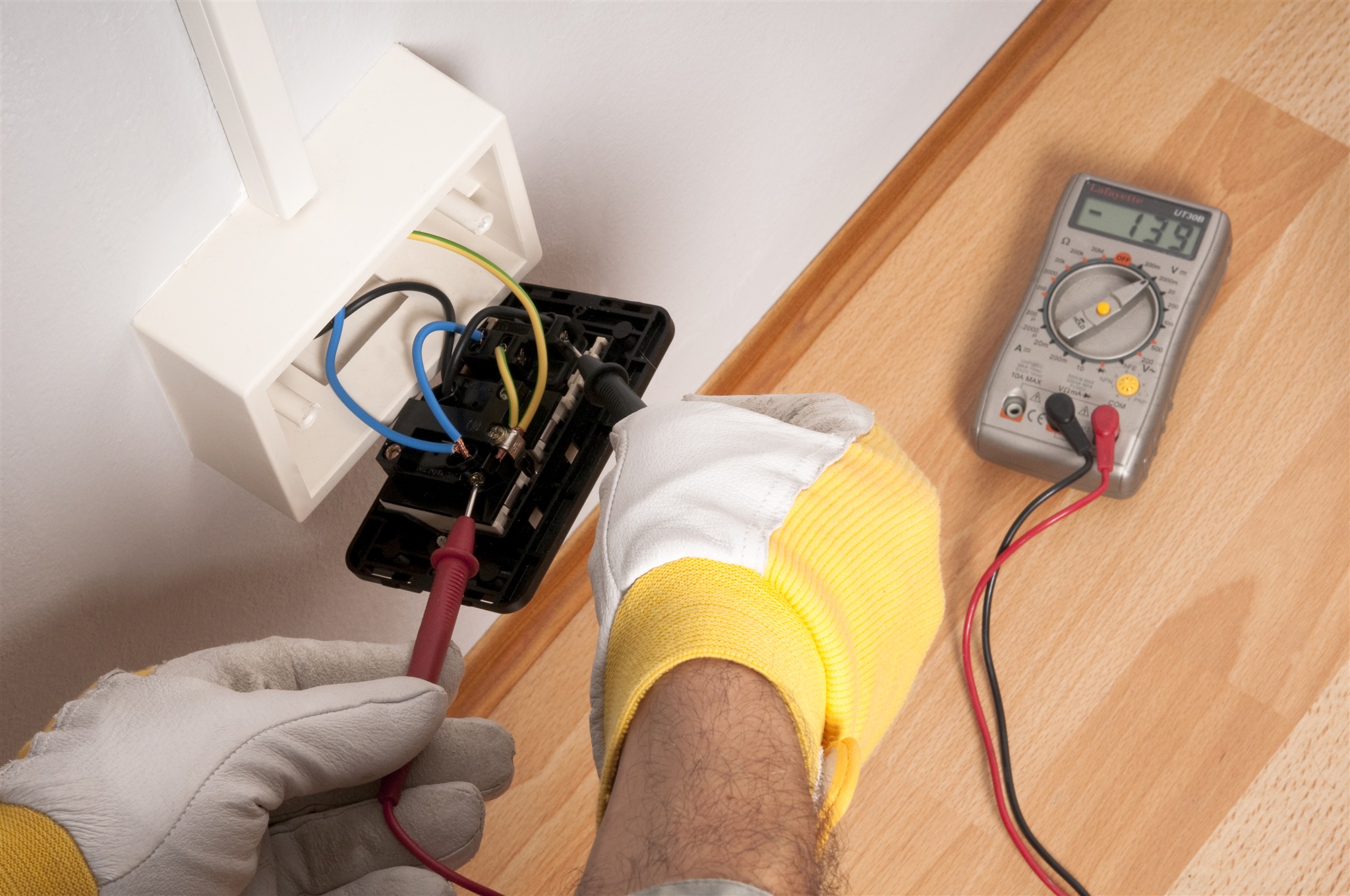 An expert working on a commercial electrical system