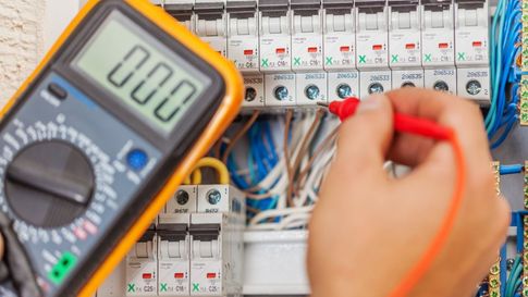 An expert working on a commercial electrical system